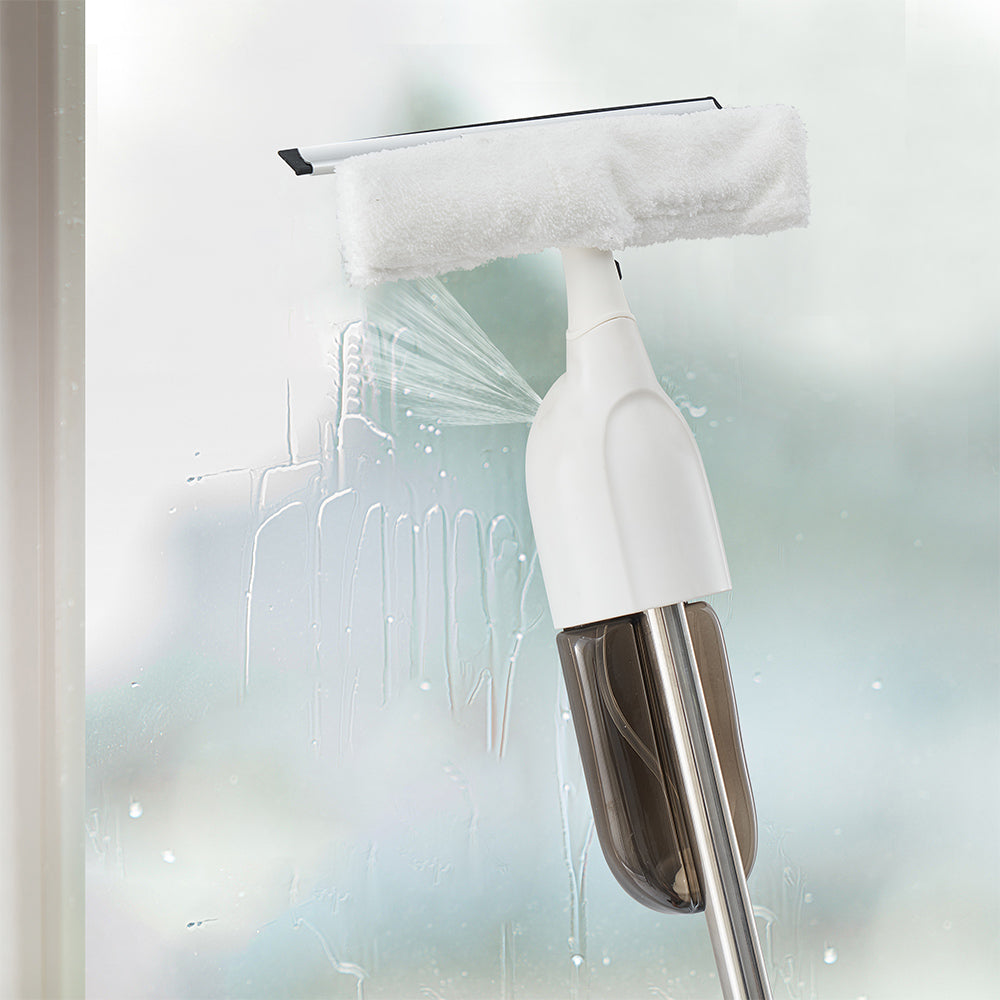 SPRAY360 + White + Cleaning-4 + window squeegee wiping glass while spraying a large spray area