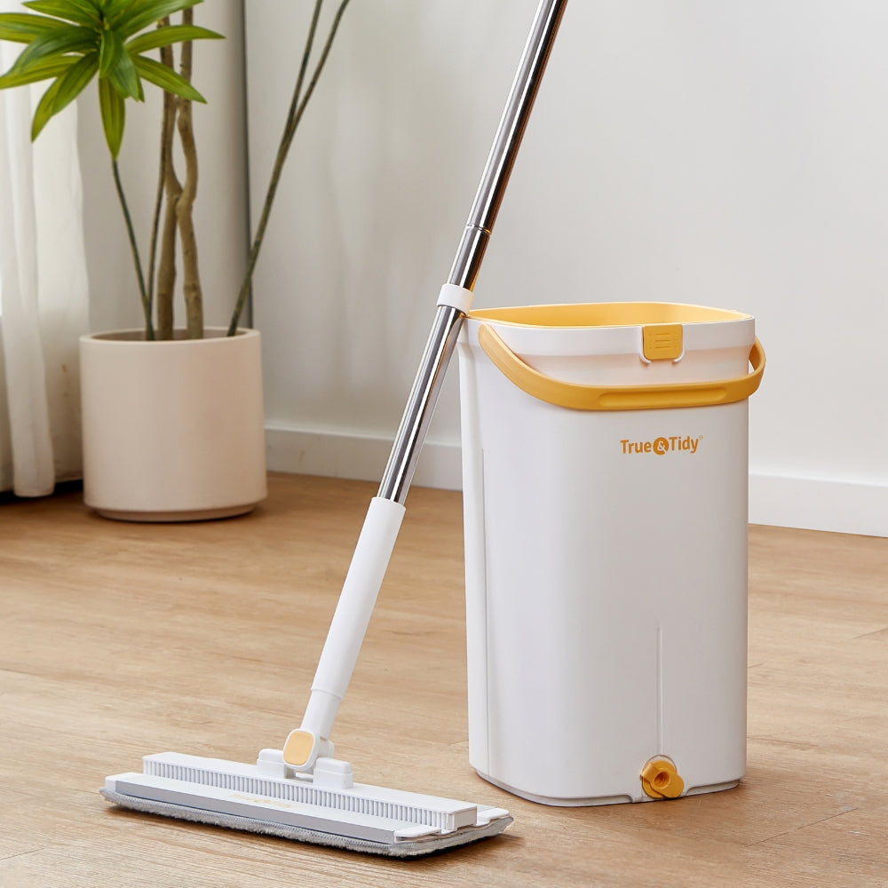 close up of mop and bucket in living room