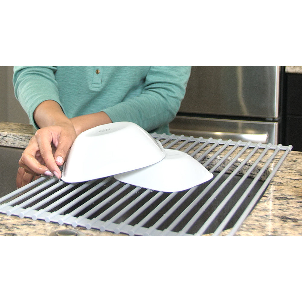 DR881 + Gray + Organization-4 + gray drying rack holding two white bowls while a woman is washing dishes