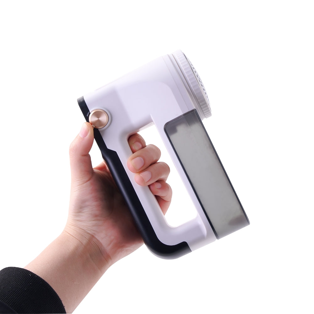 hand using thumb control on fabric shaver