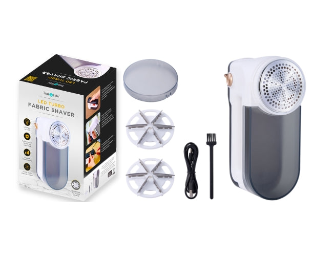 Fabric shaver with packaging, attachments, and power cord on a white background