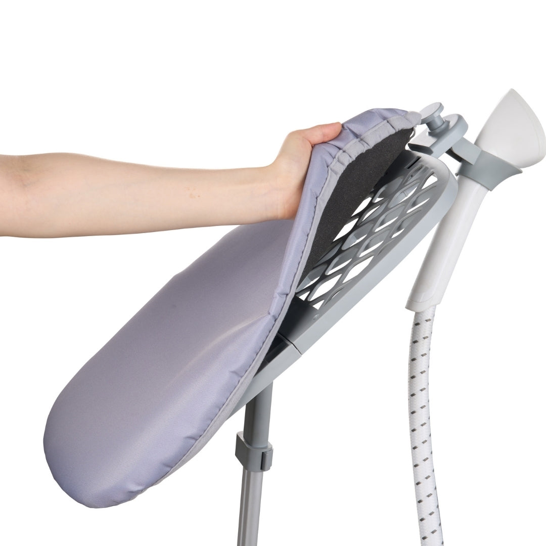 Person using a gray ironing board with a hand holding an iron on a white background