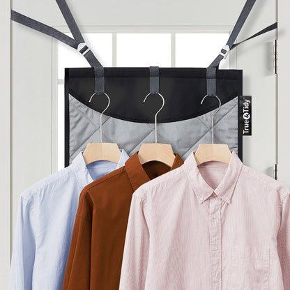 MAT200 + Black + Laundry Care-2 + MAT200 hung over a door frame with three hangers holding shirts