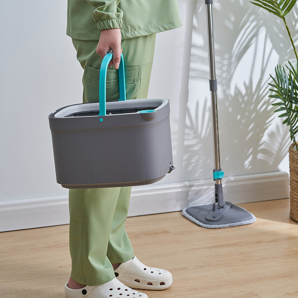 SPIN800 + Gray + Cleaning-1 + person carrying bucket with spin mop resting on wall