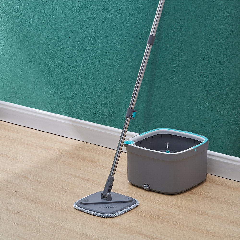 SPIN800 + Gray + Cleaning-3 + spin mop and bucket resting on teal wall