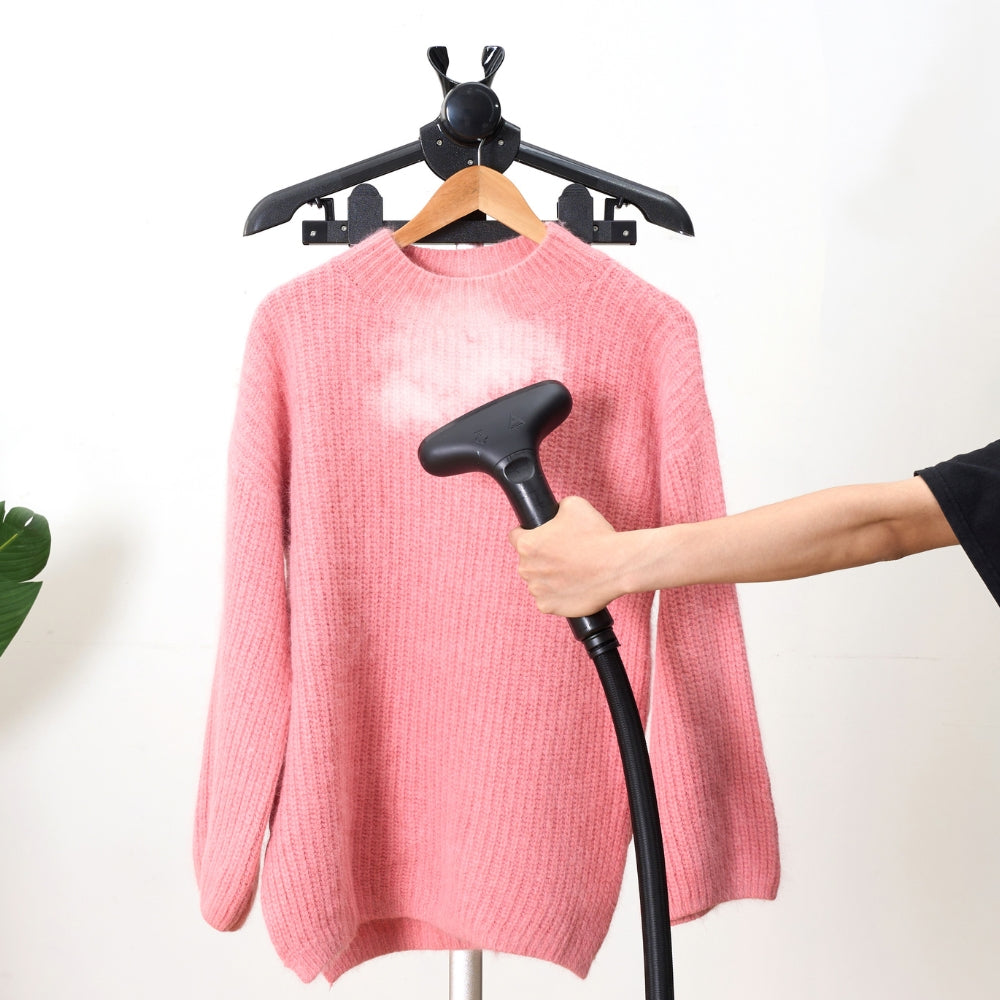 SX3 garment steamer with power steam to remove wrinkles on pink wool sweater