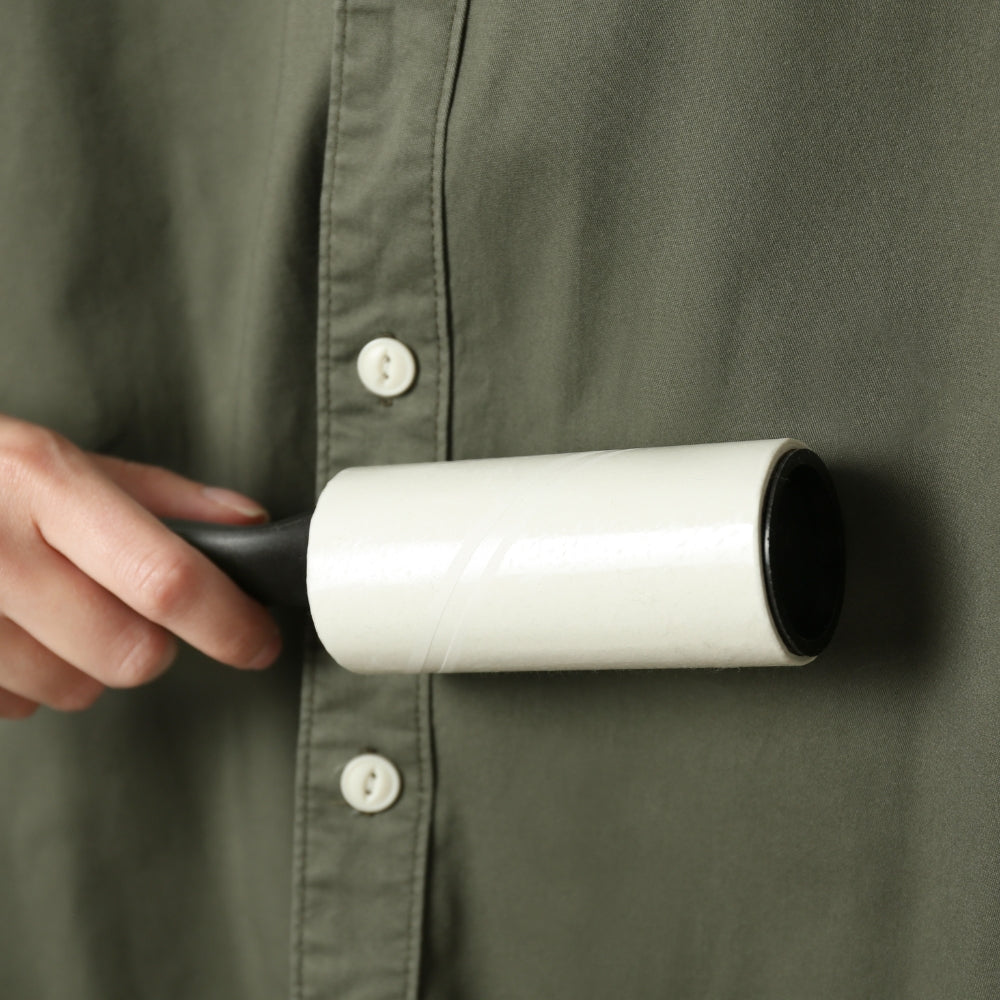 lint remover removing lint on green shirt