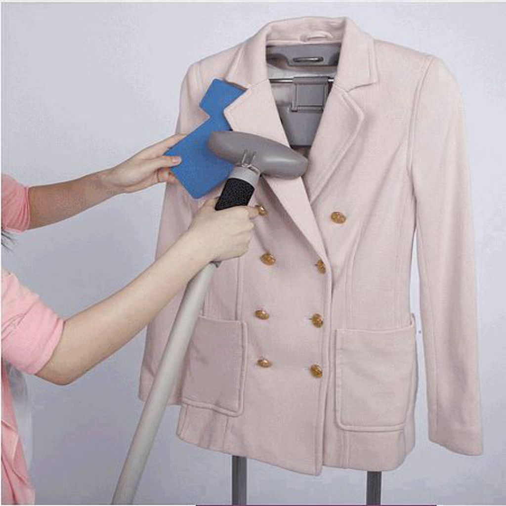 Ironing Paddle-1 + used under collar of a suit jacket to straighten and release wrinkles with a steamer