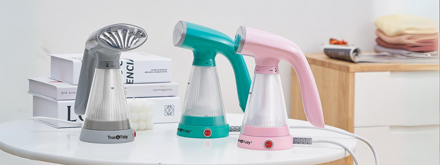 Colorful clothes steamers sitting on table