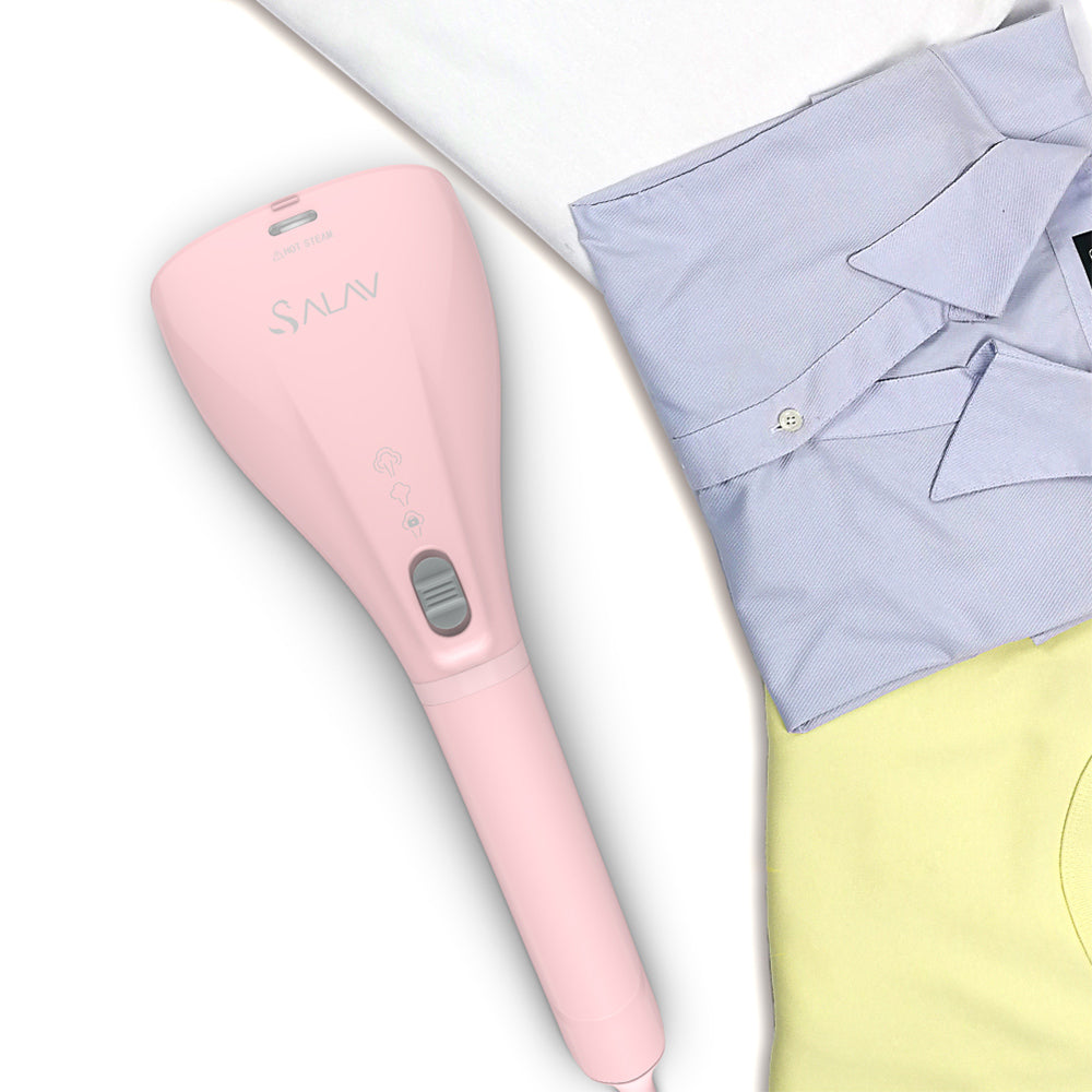 HS04 + Pink + Hand Held Steamers-6 + aerial view of portable steamer next to folded shirts