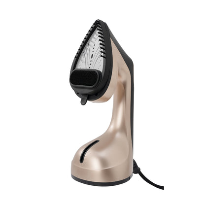 Gold handheld steamer on a white background with brush attachment on nozzle