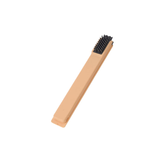 silicone scrub brush in yellow with black bristles