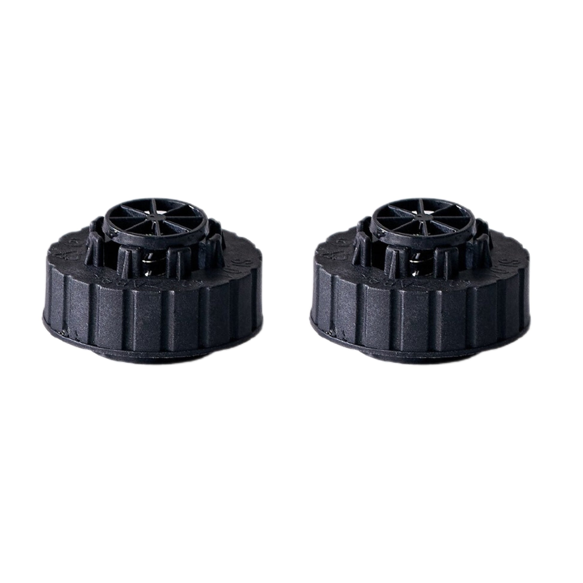 Two black plastic water tank caps on a white background