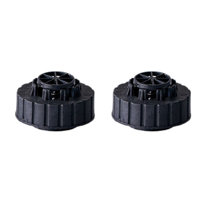 Two black plastic water tank caps on a white background
